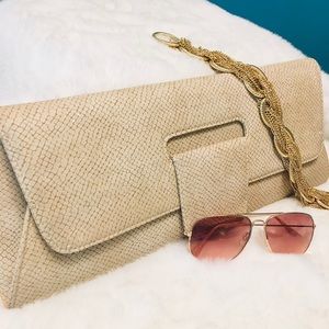 Tan snake skinned clutch